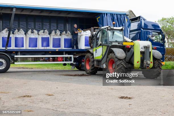 articulated lorry delivery of man made sustainable fertiliser to a farm - fertiliser stock pictures, royalty-free photos & images