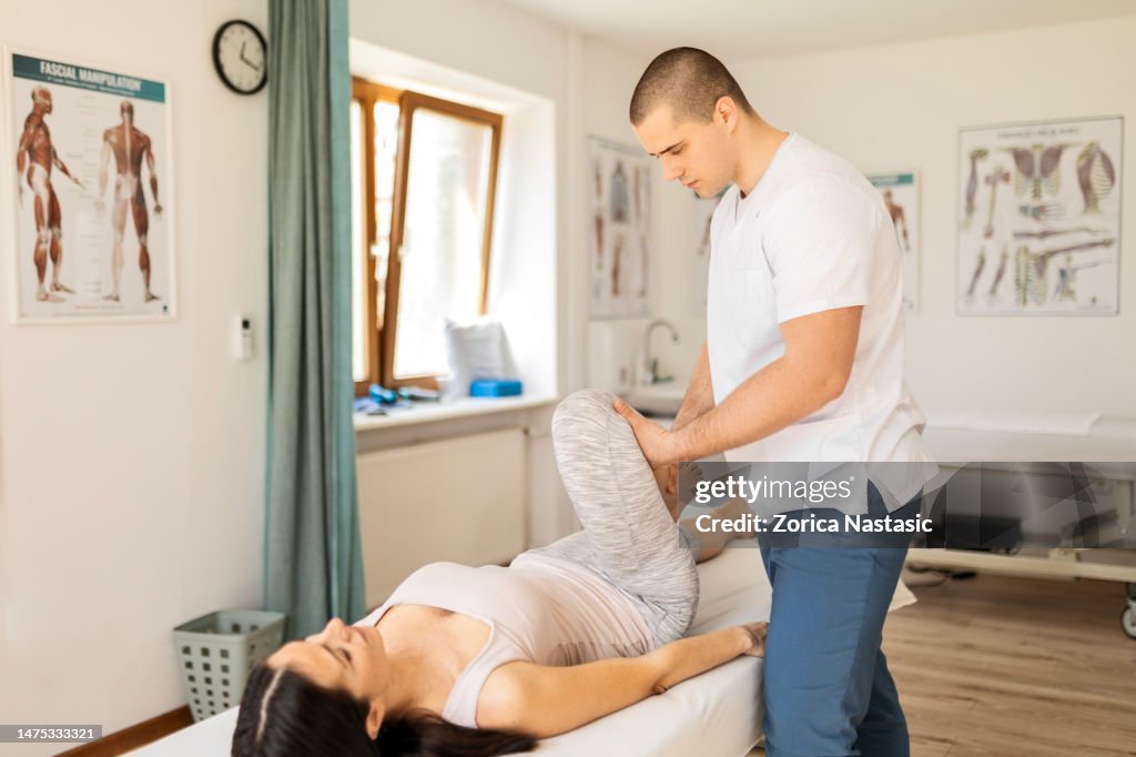 Physical therapy with female patient