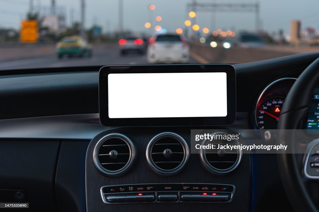 A digital display screen on the dashboard of a modern car