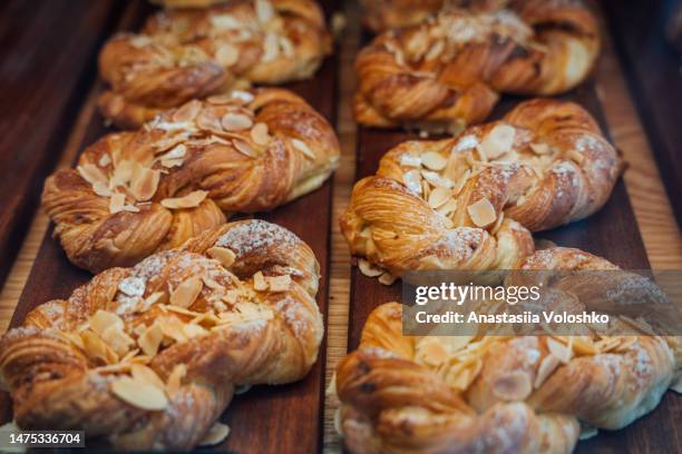 tasty fresh cinnamon buns from bakery with cardamon - breakfast pastries stock pictures, royalty-free photos & images