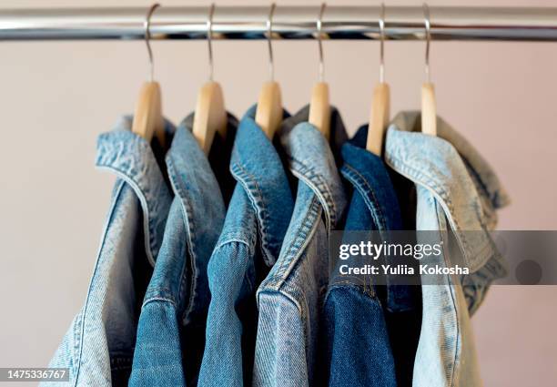 jeans jackets and retro shirts on second hand market / flea market - denim jacket stock pictures, royalty-free photos & images