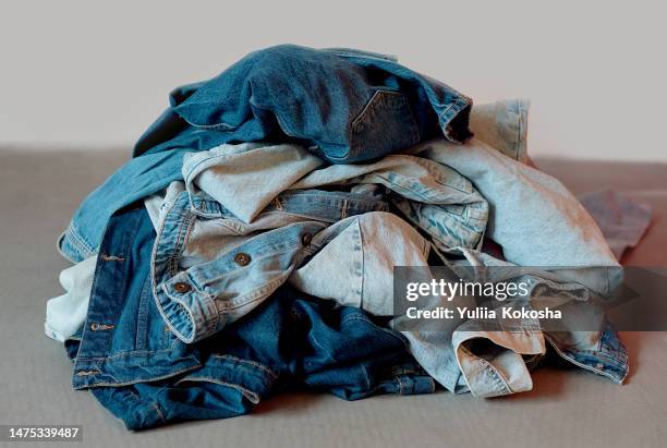 dirty clothes in a pile closeup - sports equipment pile stock pictures, royalty-free photos & images