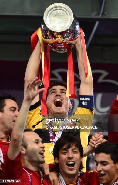 Spanish goalkeeper Iker Casillas brandishes the trophy after the Euro 2012 football championships final match Spain vs Italy on July 1, 2012 at the...