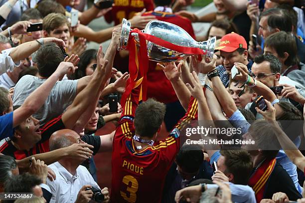 Gerard Pique of Spain celebrates with the trophy during the UEFA EURO 2012 final match between Spain and Italy at the Olympic Stadium on July 1, 2012...