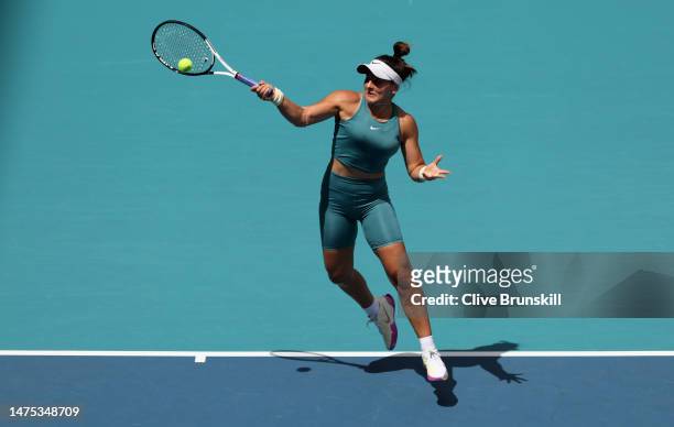 Bianca Andreescu of Canada plays a forehand against Emma Raducanu of Great Britain in their first round match during the Miami Open at Hard Rock...