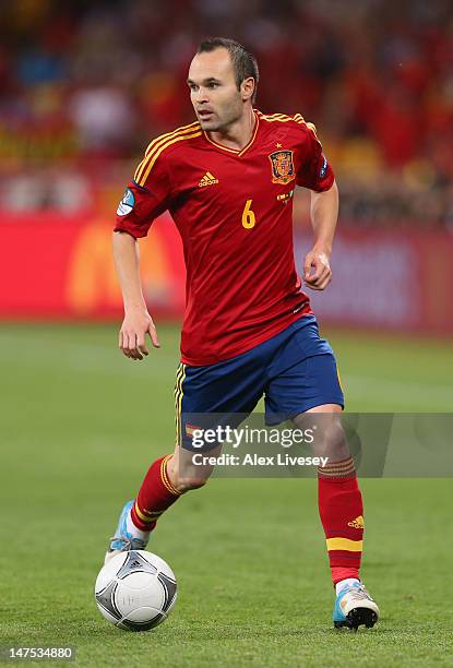 Andres Iniesta of Spain runs with the ball during the UEFA EURO 2012 final match between Spain and Italy at the Olympic Stadium on July 1, 2012 in...