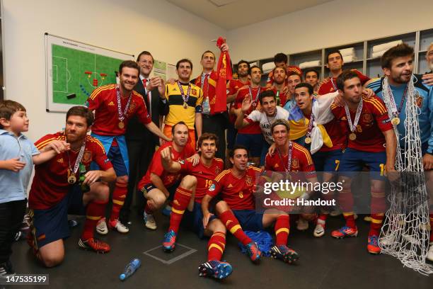 Spanish president Mariano Rajoy and Prince Felipe of Spain pose with the Spain team in the dressing room and following the UEFA EURO 2012 final match...