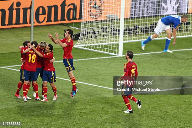Juan Mata of Spain celebrates with his team-mates after coring the fourth goal during the UEFA EURO 2012 final match between Spain and Italy at the...