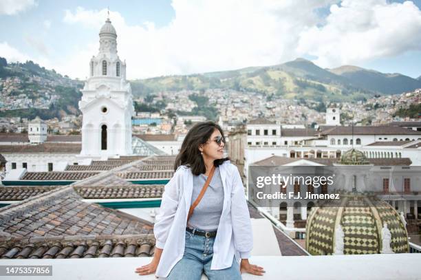 woman on roof of the cathedral of quito, ecuador - ecuador landscape stock pictures, royalty-free photos & images