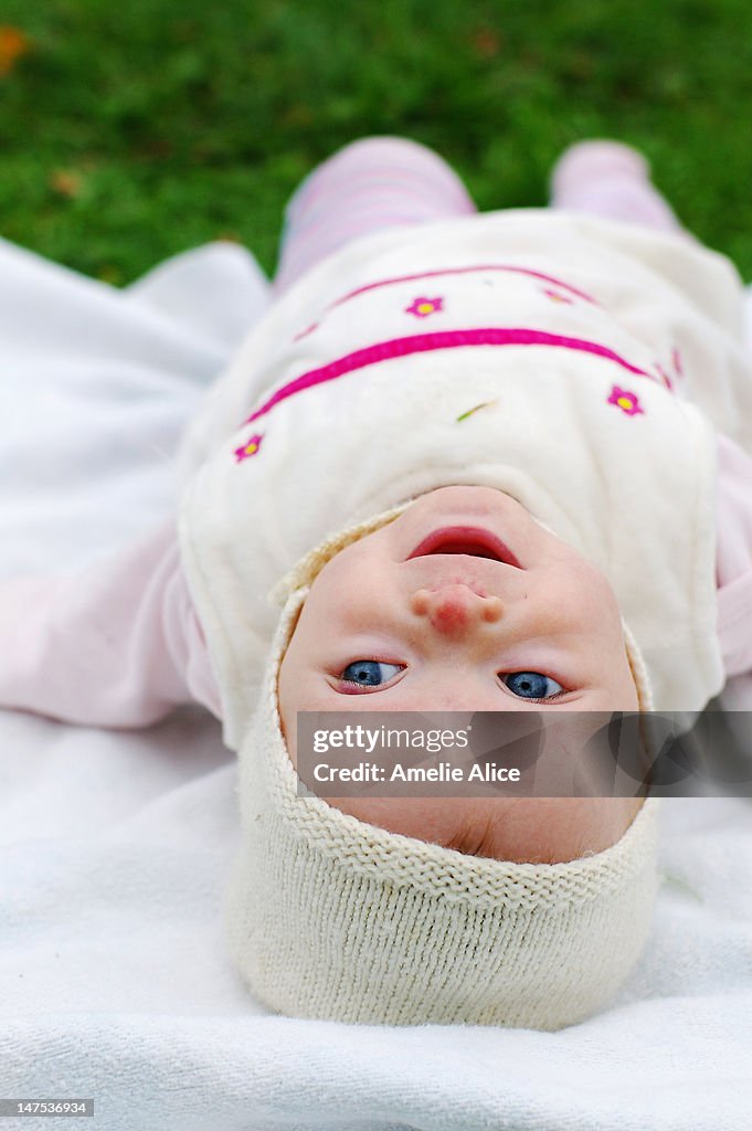 Funny happy upsidedown baby girl