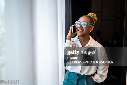 Portrait of a smiling black female entrepreneur talking on the phone Portrait of a smiling black female entrepreneur talking on the phone