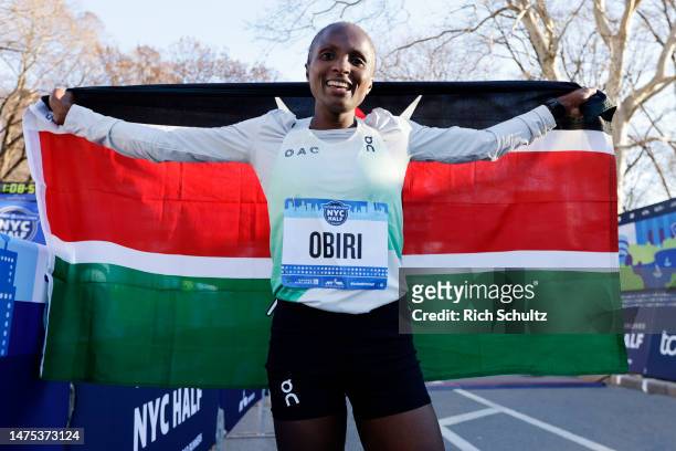 Hellen Obiri of Kenya celebrates after winning the Womens United Airlines NYC Half Marathon on March 19, 2023 in New York City.