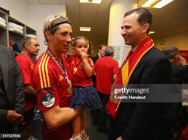 Fernando Torres of Spain speaks to Prince Felipe of Spain in the dressing room following the UEFA EURO 2012 final match between Spain and Italy at...