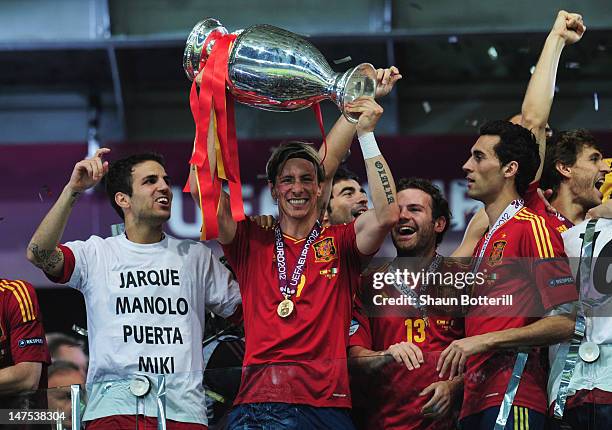 Cesc Fabregas, Fernando Torres, Juan Mata and Alvaro Arbeloa celebrate with the trophy after the UEFA EURO 2012 final match between Spain and Italy...