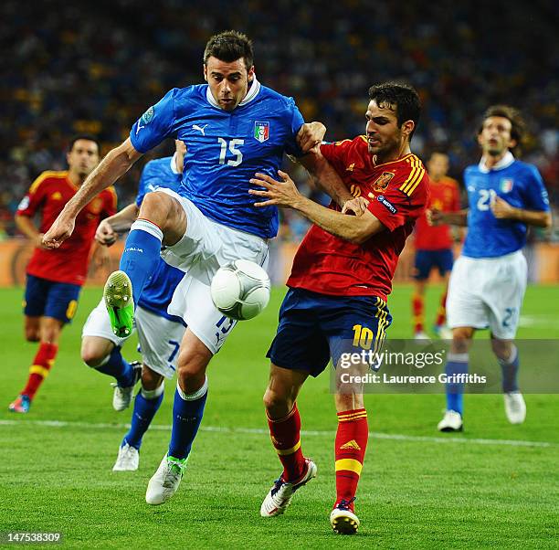 Cesc Fabregas of Spain in action against Andrea Barzagli of Italy during the UEFA EURO 2012 final match between Spain and Italy at the Olympic...