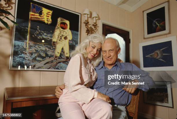 Astronaut Buzz Aldrin and his wife Lois Driggs Cannon pose for a portrait in Buzz's home office circa 1990 in Los Angeles, California