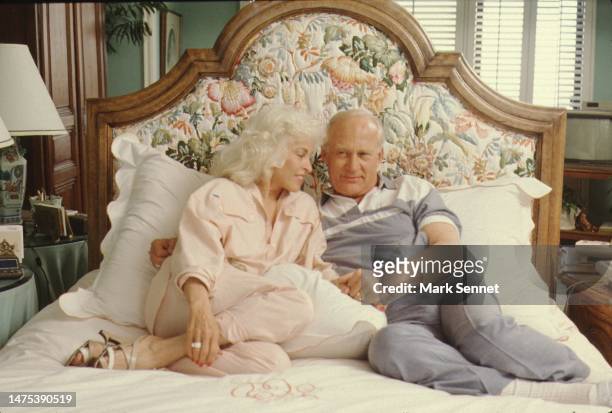 Astronaut Buzz Aldrin and his wife Lois Driggs Cannon pose for a portrait in their bedroom circa 1990 in Los Angeles, California