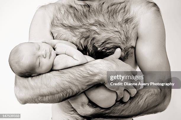 father hold naked sleeping newborn baby - brusthaar stock-fotos und bilder