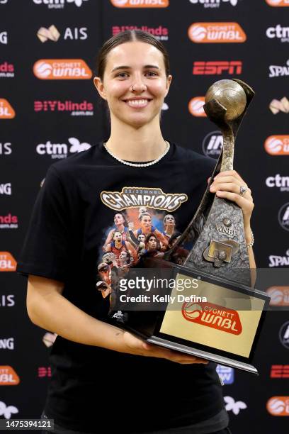 Morgan Yaeger of the Fire poses with the trophy after Townsville win the WNBL Championship during games two of the WNBL Grand Final series between...