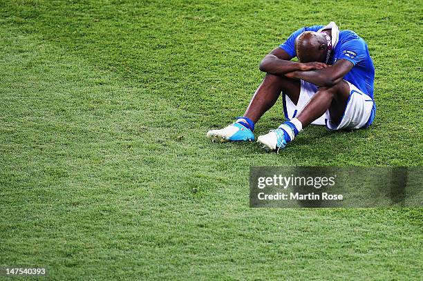 Mario Balotelli of Italy shows his dejection after the UEFA EURO 2012 final match between Spain and Italy at the Olympic Stadium on July 1, 2012 in...