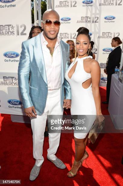 Rapper Flo Rida and model Melyssa Ford arrive at the 2012 BET Awards at The Shrine Auditorium on July 1, 2012 in Los Angeles, California.