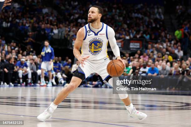 Stephen Curry of the Golden State Warriors looks to shoot the ball in the first half against the Dallas Mavericks at American Airlines Center on...