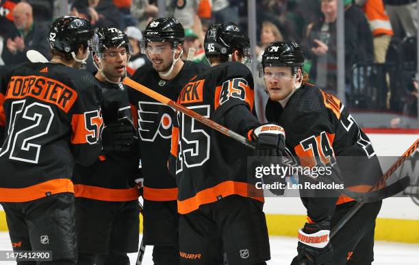 Owen Tippett of the Philadelphia Flyers celebrates his first period power-play goal against the Buffalo Sabres with Tyson Foerster, Tony DeAngelo,...