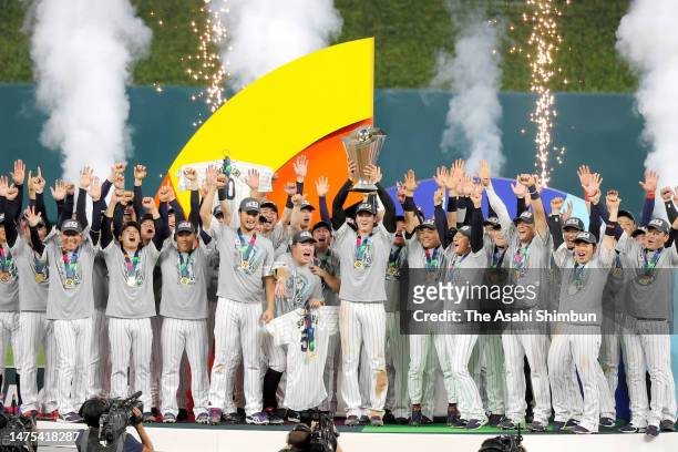 Shohei Ohtani of Team Japan lifts the trophy at the award ceremony after defeating Team USA 3-2 in the World Baseball Classic Championship between...