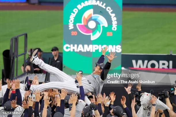 Manager Hideki Kuriyama of Team Japan is tossed into the air after defeating Team USA 3-2 in the World Baseball Classic Championship between USA and...