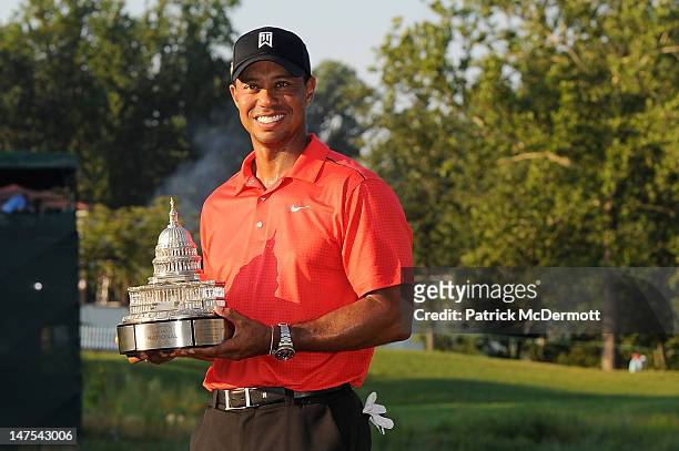 Tiger Woods poses with the winner's trophy after winning the AT&T National at Congressional Country Club on July 1, 2012 in Bethesda, Maryland.
