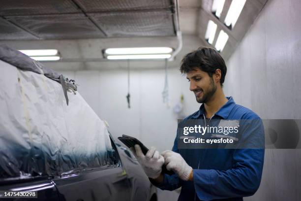 young entrepreneur work at car garage. - car bodywork stock pictures, royalty-free photos & images