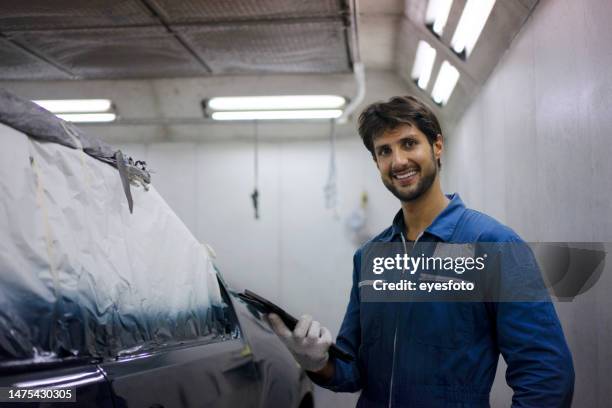 young entrepreneur work at car garage. - karosseriarbete bildbanksfoton och bilder