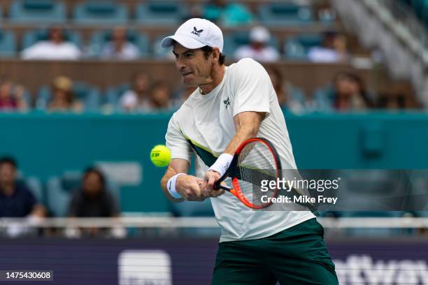 Andy Murray of great Britain hits a backhand against Dusan Lajovic of Serbia in the Miami Open at the Hard Rock Stadium on March 22, 2023 in Miami...