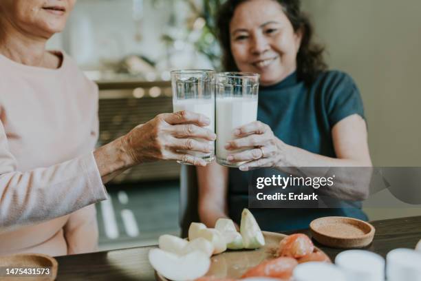 osteoporosis,good food for our good health. - glass of milk stock pictures, royalty-free photos & images