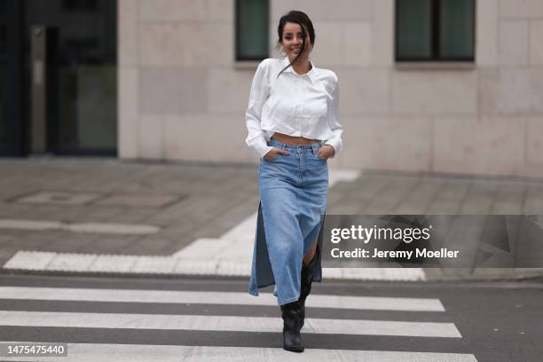 Tara Tut seen wearing Trendyol blue denim long skirt, Zara cropped silk white blouse and Zara brown and black Cowboy boots and golden earrings on...