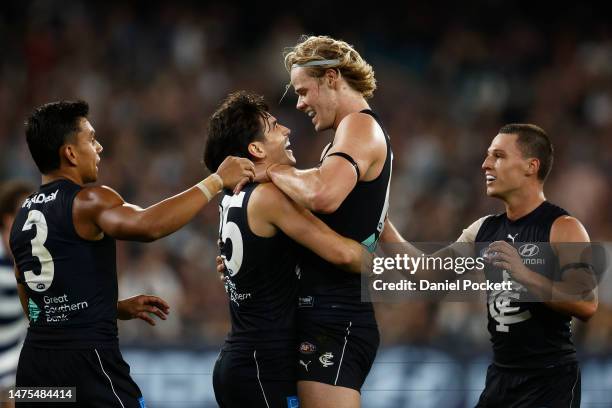 Zac Fisher of the Blues celebrates with Tom De Koning of the Blues after kicking a goal during the round two AFL match between Carlton Blues and...