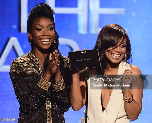 Signer Brandy Norwoord and actress Lauren London present an award onstage during the 2012 BET Awards at The Shrine Auditorium on July 1, 2012 in Los...