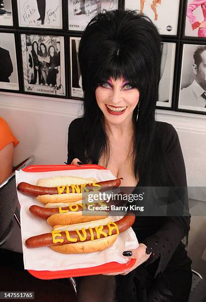 Actress Cassandra Peterson attends the launch of her new signature Elvira hot dog at Pink's Hot Dogs on July 1, 2012 in Los Angeles, California.