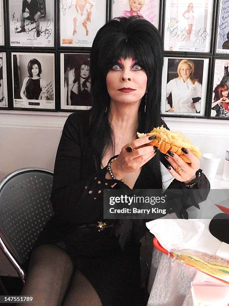 Actress Cassandra Peterson attends the launch of her new signature Elvira hot dog at Pink's Hot Dogs on July 1, 2012 in Los Angeles, California.