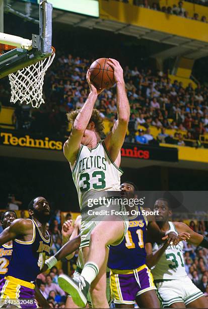 Larry Bird of the Boston Celtics pulls down a rebound against the Los Angeles Lakers during the 1984 NBA Finals June 1984 at The Boston Garden in...