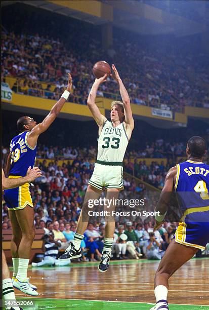 Larry Bird of the Boston Celtics shoots over Kareem Abdul-Jabbar of the Los Angeles Lakers during the 1984 NBA Finals June 1984 at The Boston Garden...