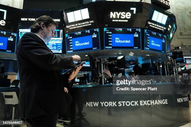 Traders work on the floor of the New York Stock Exchange on March 23, 2023 in New York City. The Dow was up over 200 points in morning trading a day...