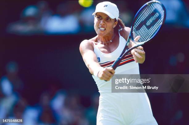 Jennifer Capriati of USA in action against Serena Williams of USA during the Women's Quarterfinal match at The Wimbledon Lawn Tennis Championship at...