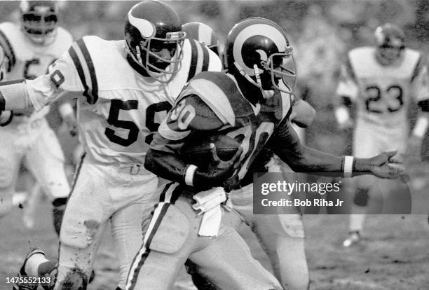 Rams RB Lawrence McCutcheon on running play during rainstorm at NFC Playoff Game between Los Angeles Rams and Minnesota Vikings, December 26, 1977 in...