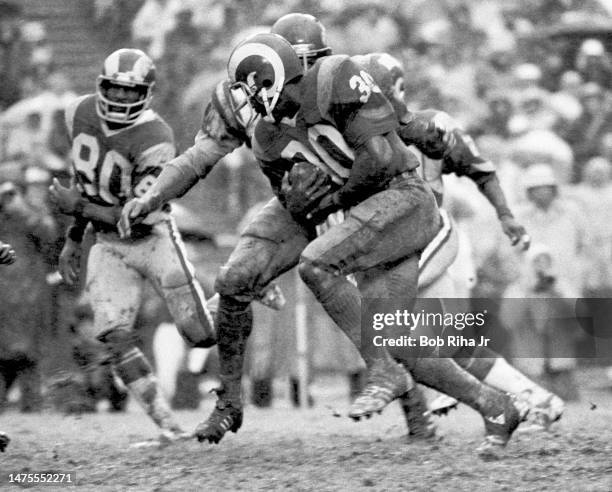 Rams RB Lawrence McCutcheon on running play during rainstorm at NFC Playoff Game between Los Angeles Rams and Minnesota Vikings, December 26, 1977 in...