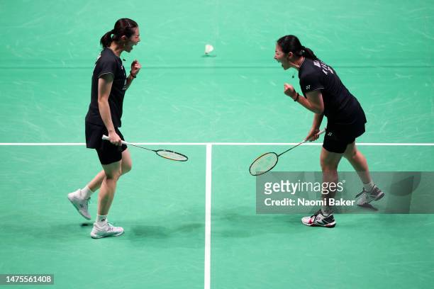 So Yeong Kim and Hee Yong Kong of Korea celebrate winning a point during their Women's Doubles quarter final match against Qing Chen Chen and Yi Fan...