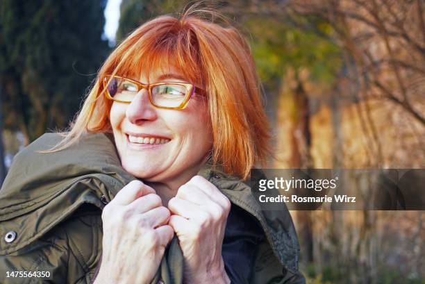 italian woman in her sixties, funny pose - senior colored hair stock pictures, royalty-free photos & images