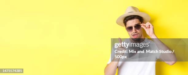 concept of tourism and vacation cool and sassy man flirting with you - sassy shades foto e immagini stock