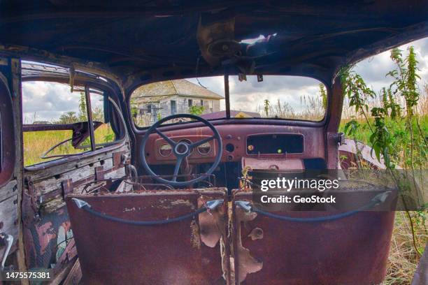 rotting interior of a vintage car - rusty old car fotografías e imágenes de stock