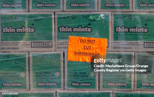 Irvine, CA A stack of some of one million packages of Girl Scout cookies await loading during the Mega Delivery Girl Scout cookie pick up at the...